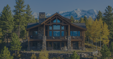 Luxury timber-frame vacation home in Pagosa Springs Colorado featuring stone accents and panoramic San Juan Mountain views